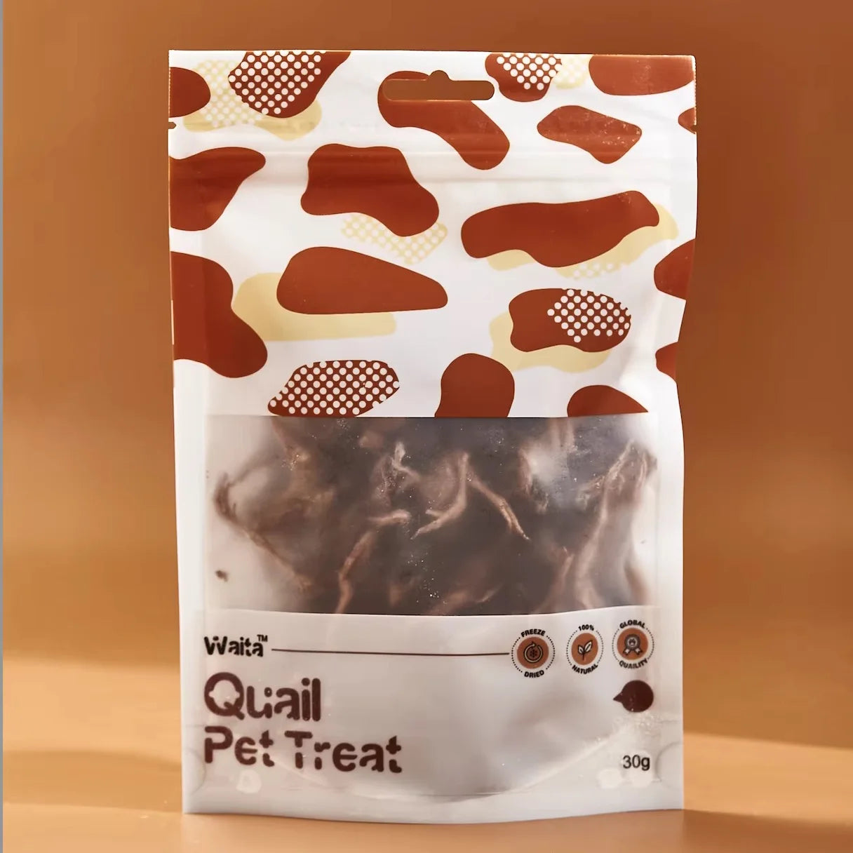 Package of quail pet treats with a brown and white pattern on a brown background