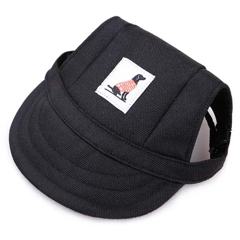Black pet harness with a small label featuring a dog in a sweater on a white background