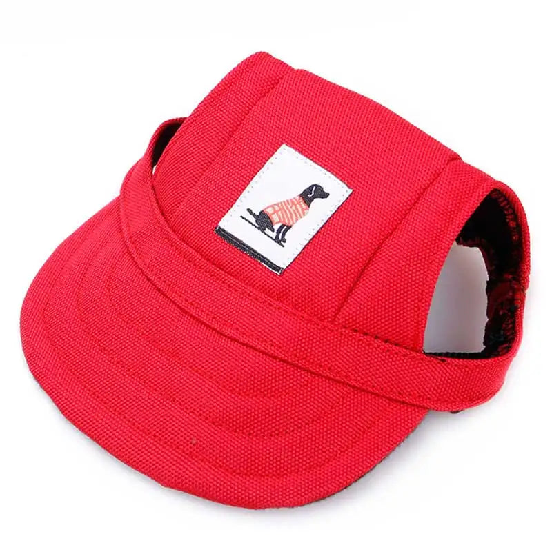 Red pet visor with a small patch featuring a dog design on a white background