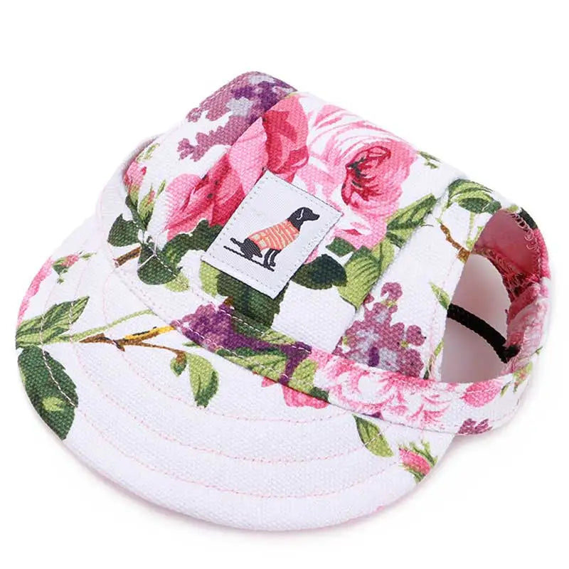 Floral-patterned pet hat with a brand label on a white background