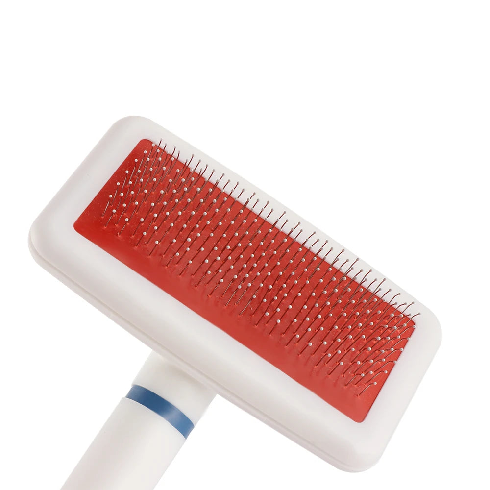 Pet grooming brush with red rubber block on a white background