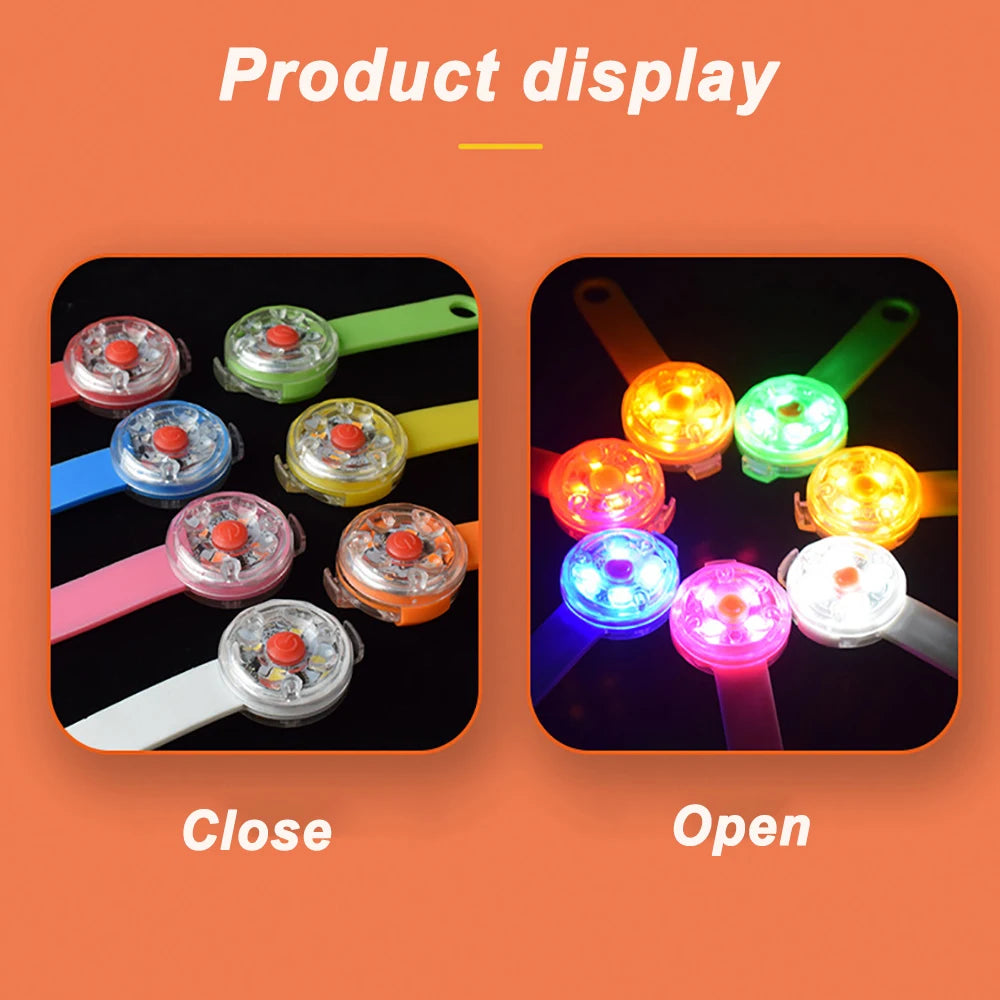 Colorful LED wristbands in open and close positions on an orange background