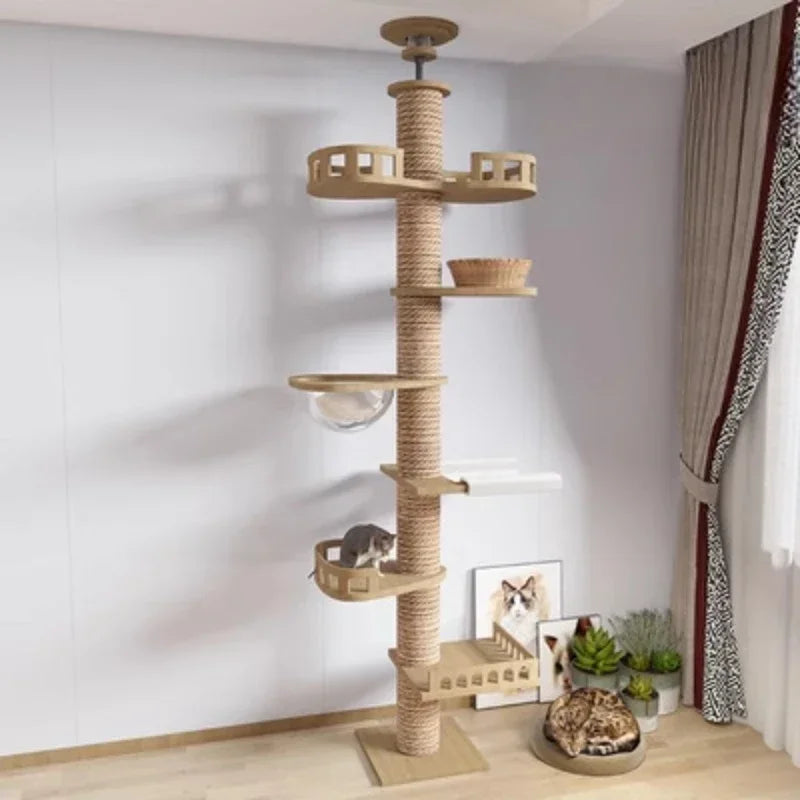 Cat tree with multiple levels and perches in a room setting.