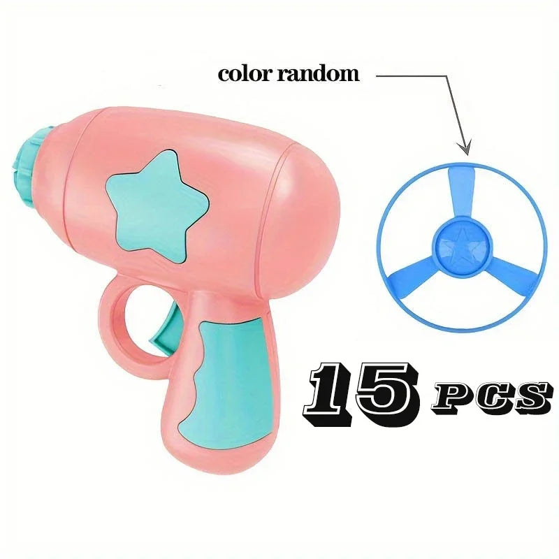 Pink and blue toy gun with star design on a white background, labeled 'color random' and '15 pcs'.