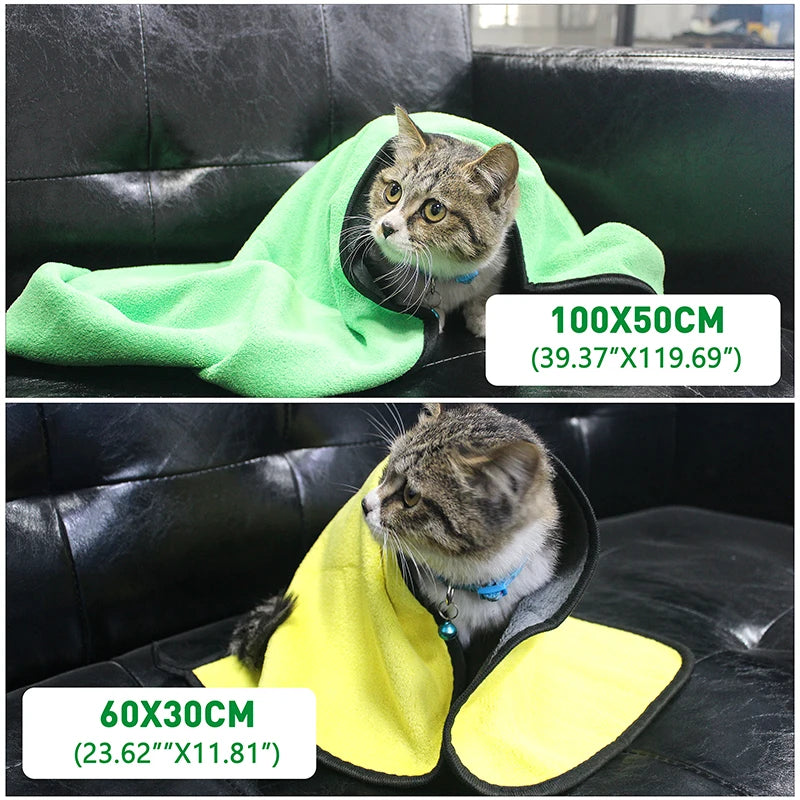 A medium-sized towel drying a cat after a bath.