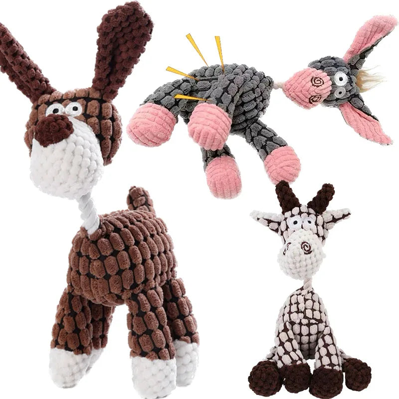 Set of four knitted animal toys on a white background