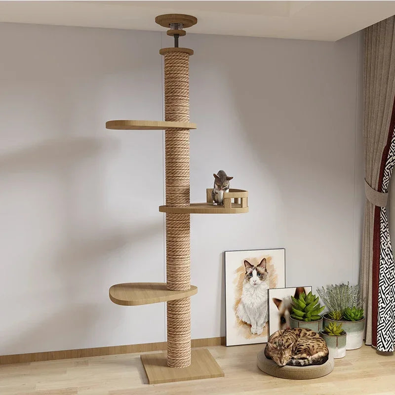 Cat tree with shelves and a cat sitting on it in a room with decor elements.
