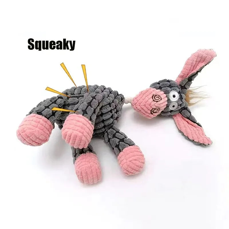Gray and pink plush toy with a squeaky mechanism on a white background