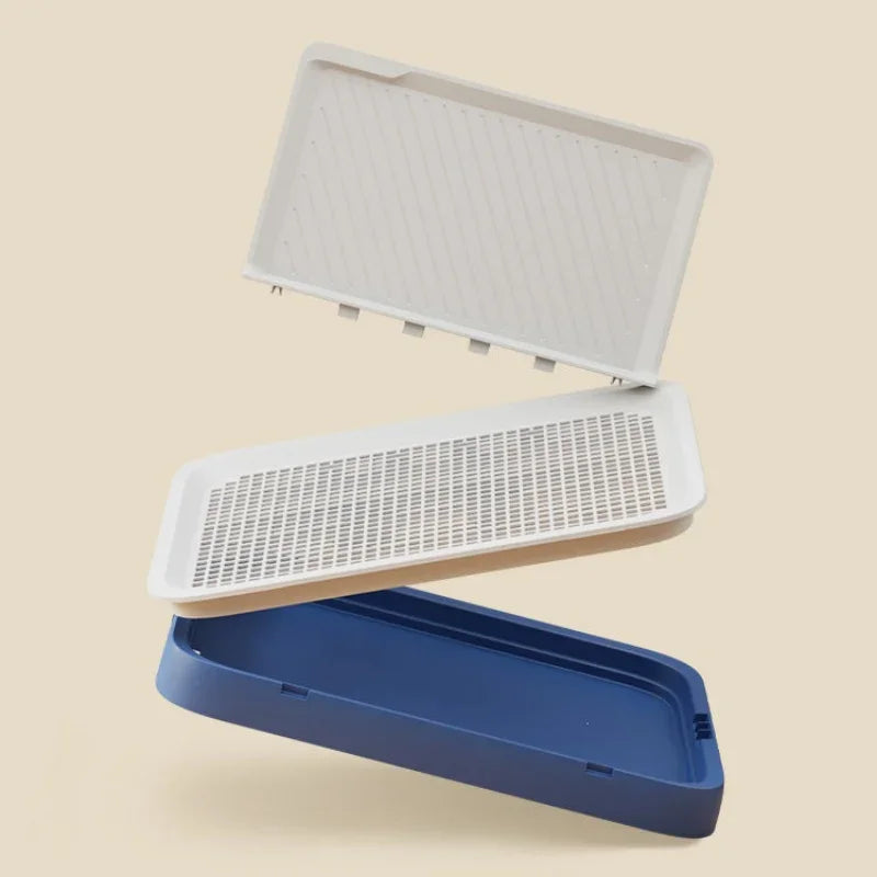Three plastic trays with different colored bases on a beige background