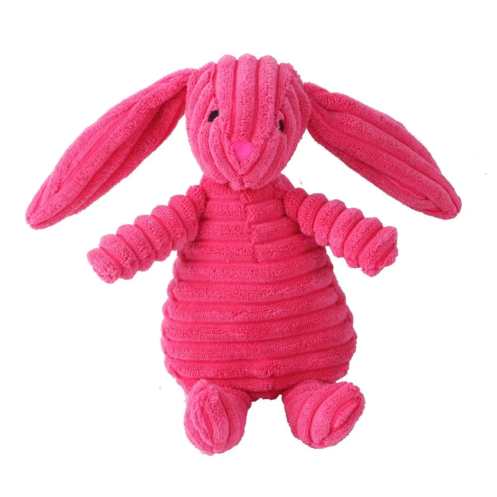 Pink plush bunny toy on a white background