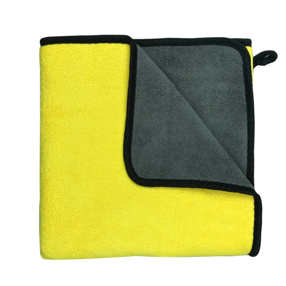 A stack of clean, machine-washed microfiber pet towels.