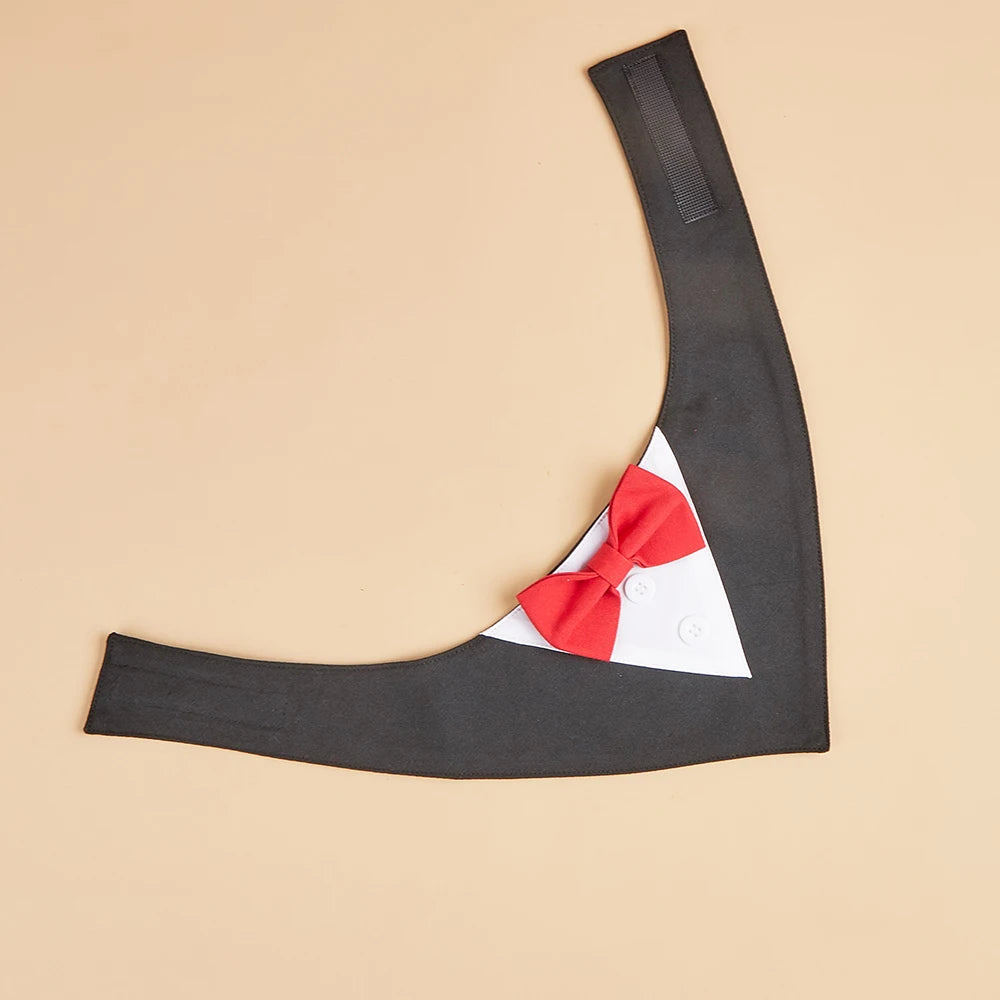 Black arm sleeve with a red and white bow tie on a beige background