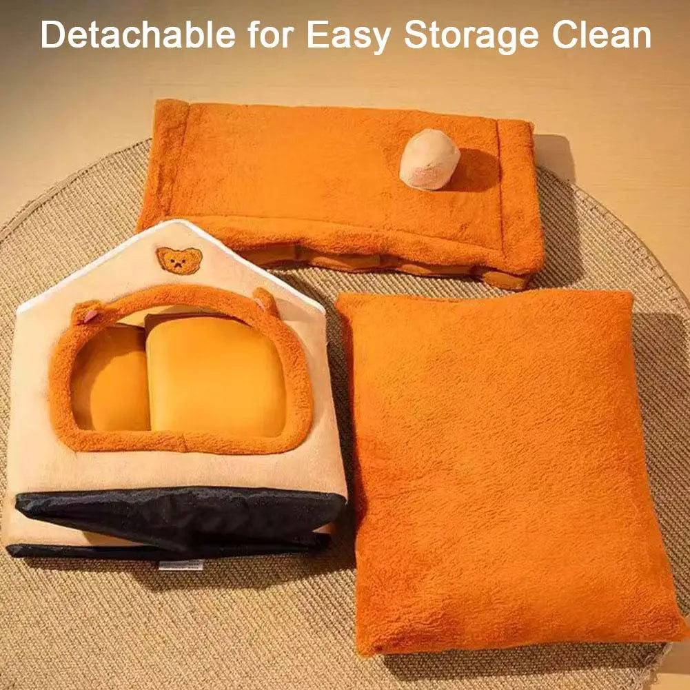 Orange pet bed with detachable cover on a textured surface