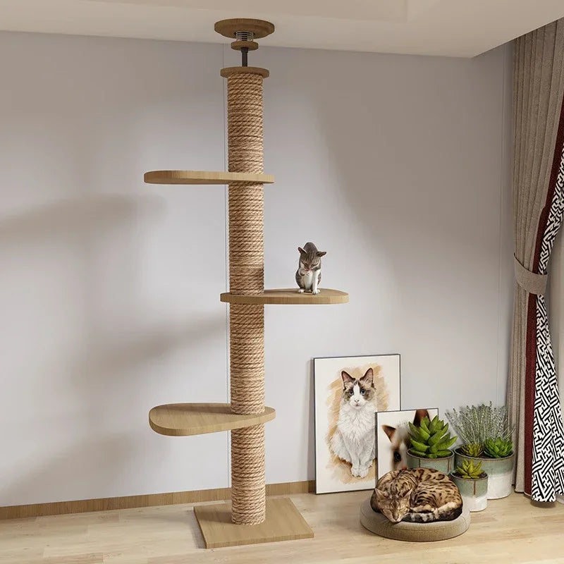 Cat tree with shelves and a cat sitting on a platform in a room with decor elements.