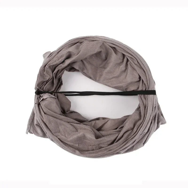 Brown scarf draped over a white mannequin head on a white background
