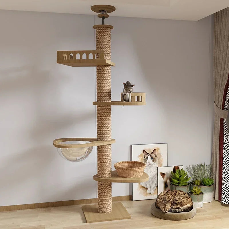 Cat tree with multiple levels and a cat sitting on one of the platforms in a room.