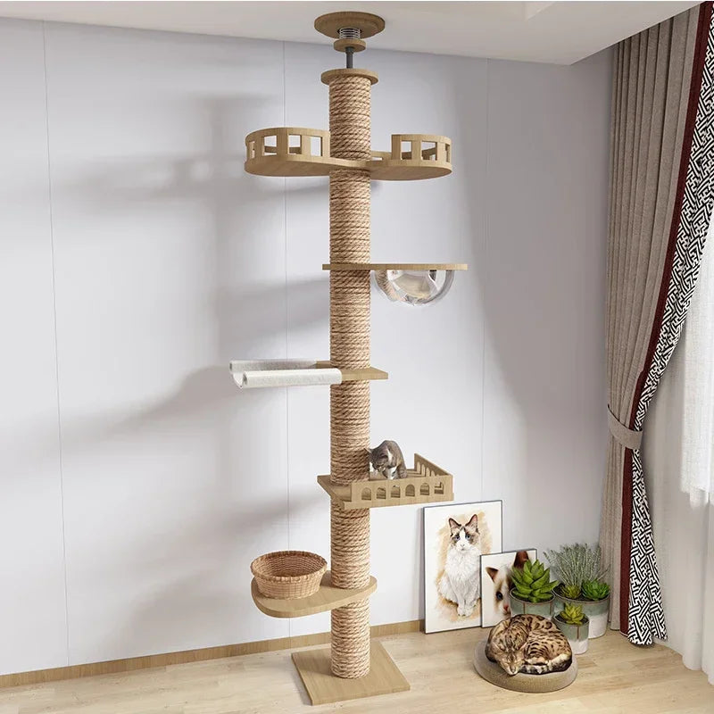 Cat tree with multiple levels and a cat sitting on one of the platforms in a room.