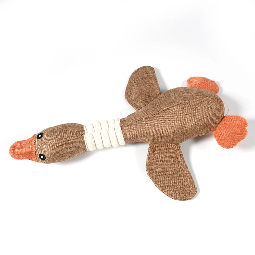 Textured brown and orange duck-shaped toy on a white background