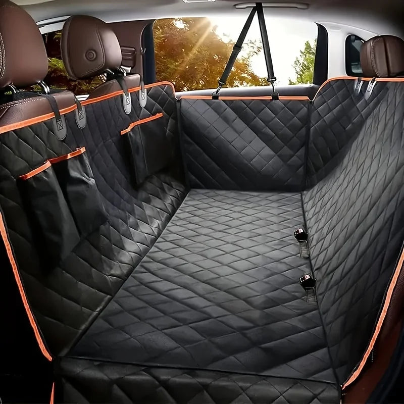 Car interior with black quilted bench cover and orange accents