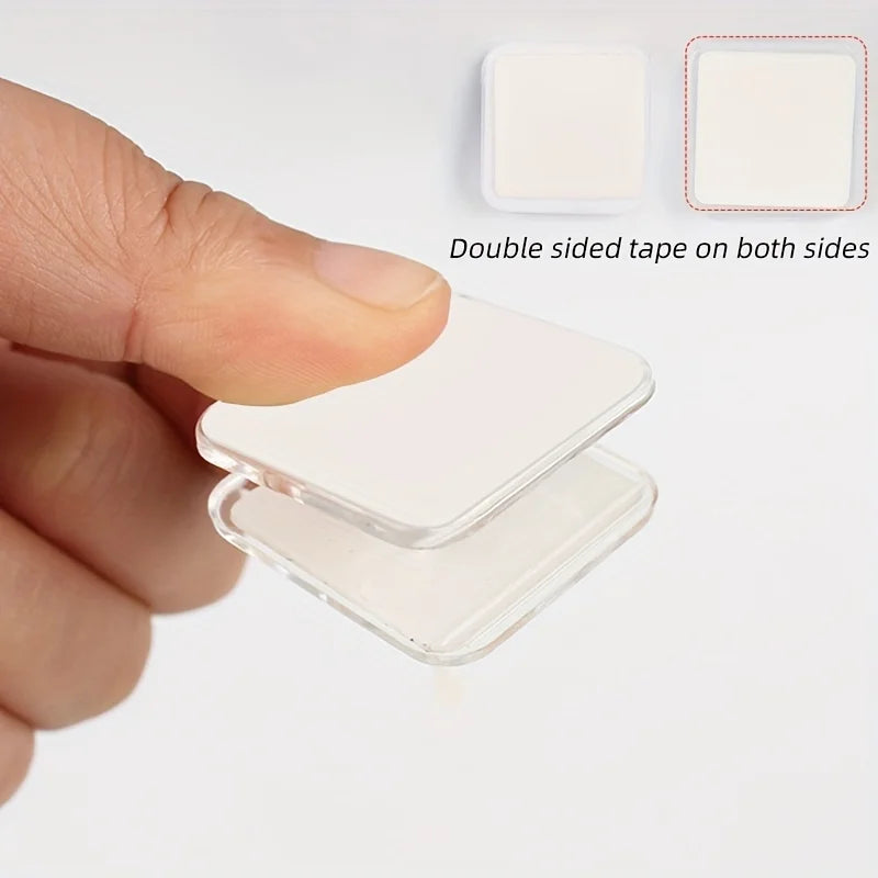 Close-up of stickable plastic clip holding a pee pad securely.