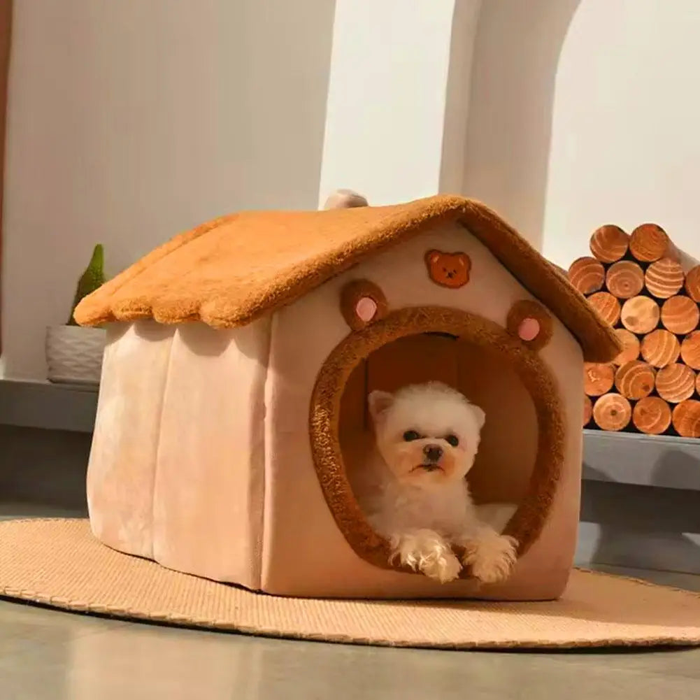 Small white dog inside a cozy dog house with a teddy bear design.