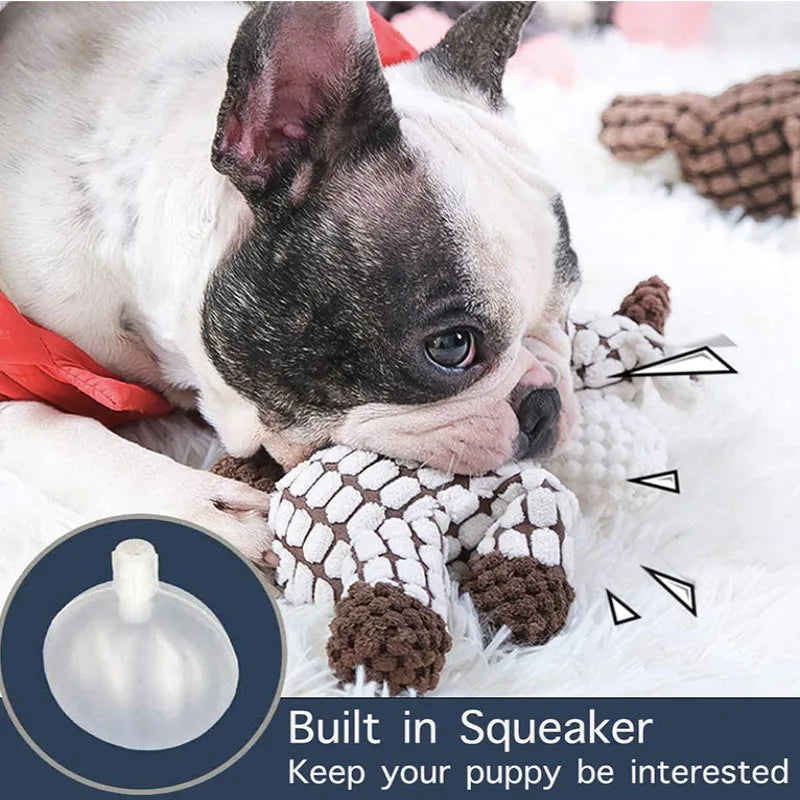 Puppy playing with a chew toy, highlighting the built-in squeaker feature.