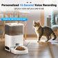 Cat standing next to a pet feeder with a voice recording feature, in a home setting.