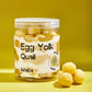 Jar of egg yolk quail products with a yellow background