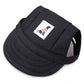 Black pet harness with a small label featuring a dog in a sweater on a white background
