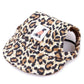 Leopard print cap with a brand label on a white background