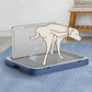 Dog using a self-cleaning dog bath mat with water spraying onto it.