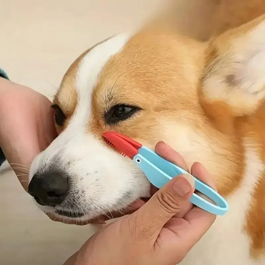 Silicone eye cleaning brush for cats in vibrant yellow.