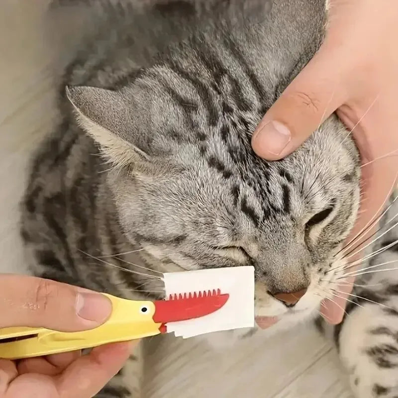 Pet grooming brush showing ergonomic handle and soft bristles.