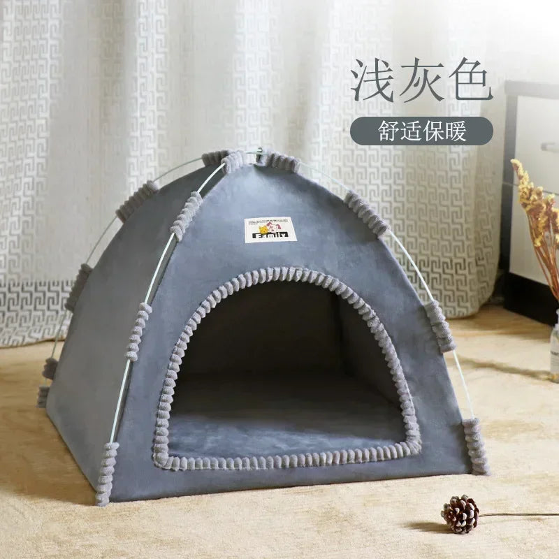 Gray pet tent on a wooden floor with a white curtain in the background