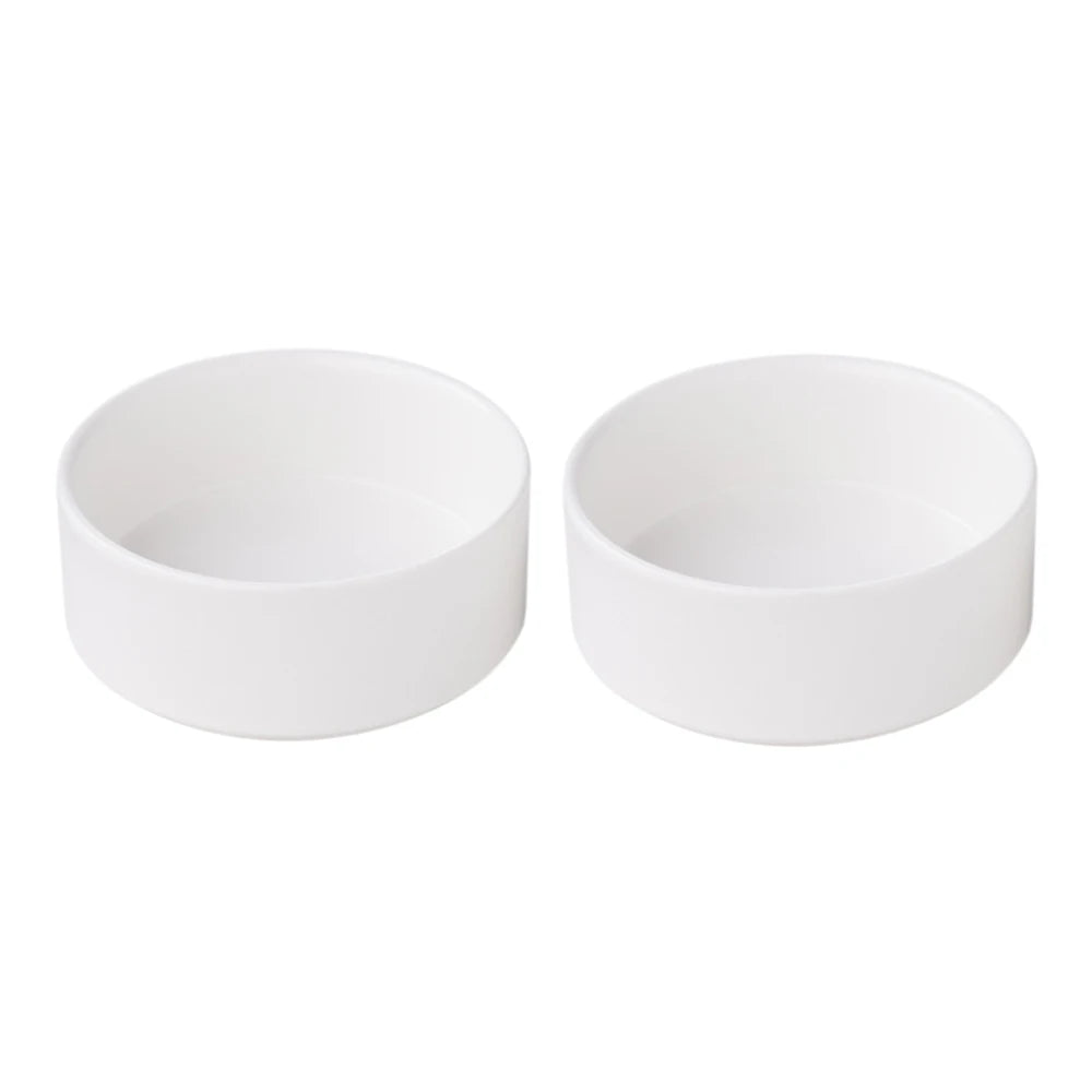 Two white ceramic bowls on a white background