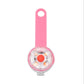 Pink and clear device with a red button on a white background