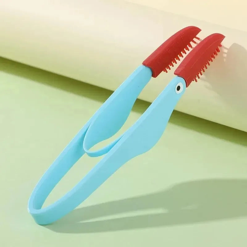 Multi-functional pet brush for eye and ear cleaning in blue color."