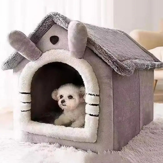 Dog peeking out from a gray pet house with bunny ears on a white carpet.