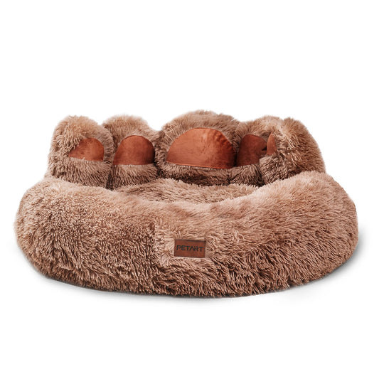 Brown fluffy pet bed with paw-shaped handles on a white background