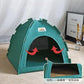 Green pet tent with a label on a light-colored floor.