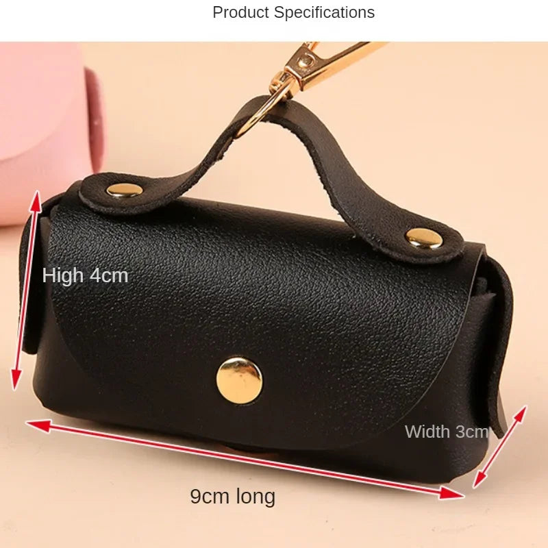 Attachable poop bag holder on a pet owner’s backpack strap.