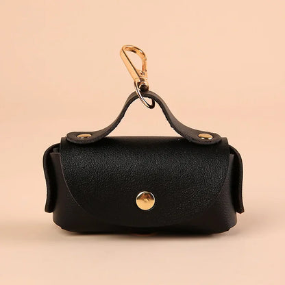 Dog poop bag holder as a stylish accessory for pet owners.