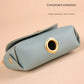 Compact and lightweight dog poop bag holder in use outdoors.