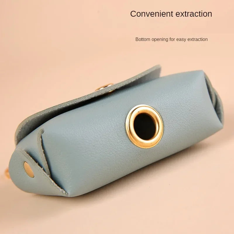 Compact and lightweight dog poop bag holder in use outdoors.