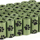Multiple rolls of green pet waste bags with black paw prints on a white background